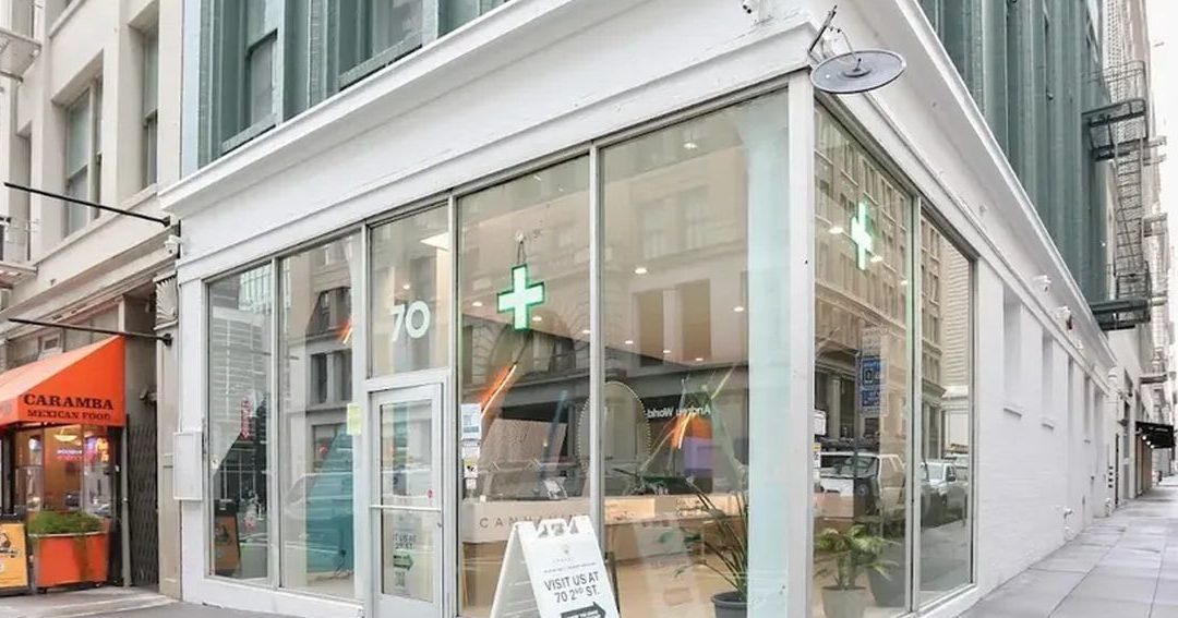 Cannavine cannabis dispensary storefront with green cross sign in San Francisco